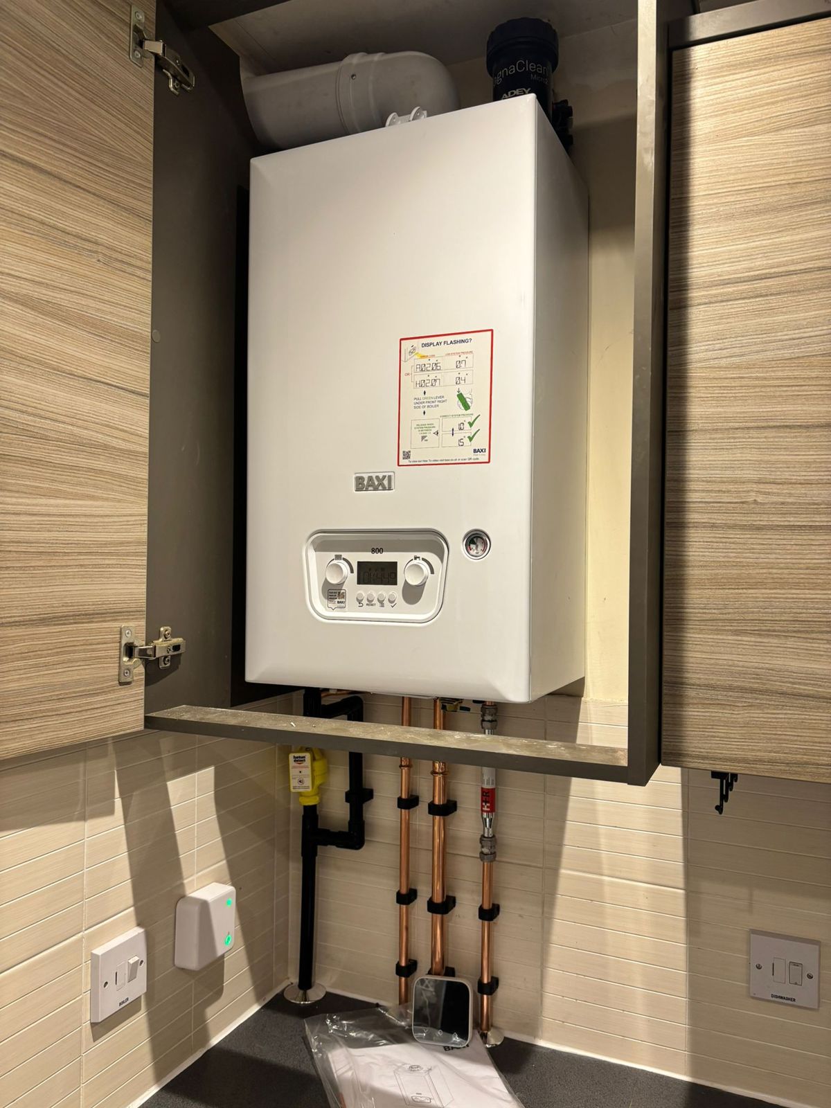 New Baxi combi boiler fitted in a kitchen cupboard in Rushden