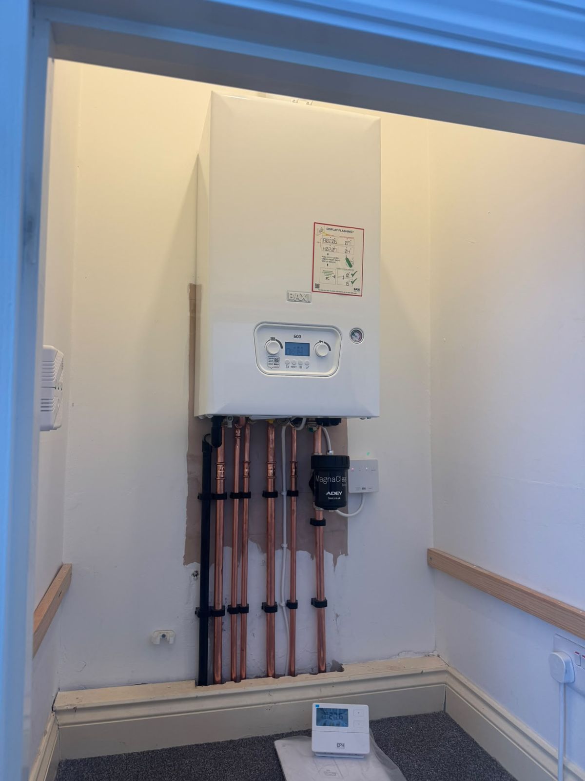 Wall-hung Baxi boiler with neat copper pipework in Wellingborough
